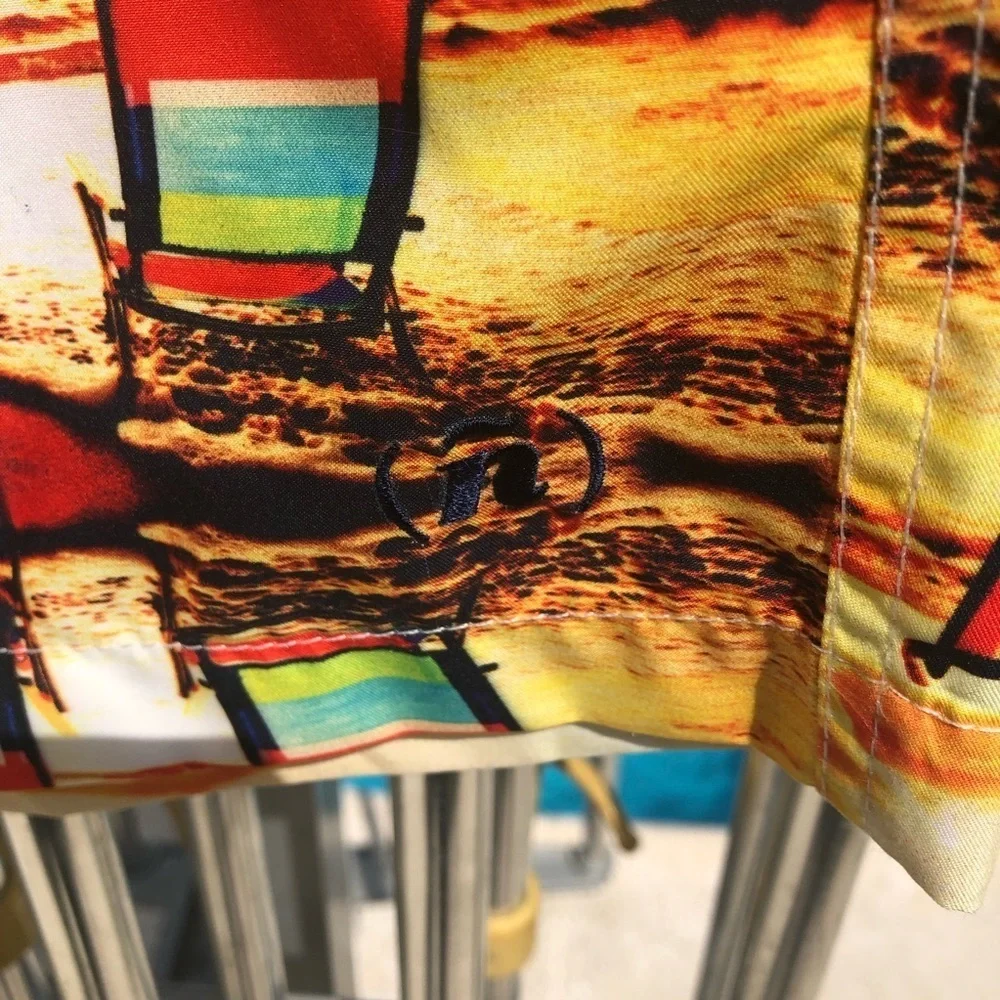 Spenglish tropical swim trunks.